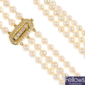 A cultured pearl three-row necklace, with diamond clasp.