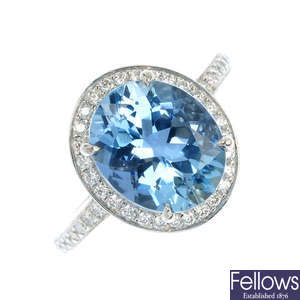 TIFFANY & CO. - a platinum aquamarine and diamond cluster ring.