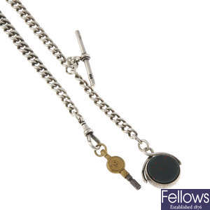A pocket watch chain with fob.