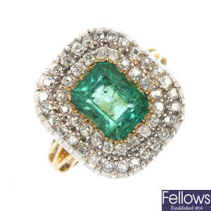 An early 19th century silver and gold emerald and diamond cluster ring.