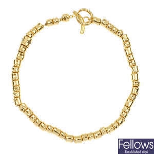 LINKS OF LONDON - an 18ct gold 'Allsorts' bracelet.