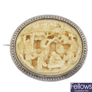 A late 19th century gold carved ivory brooch.