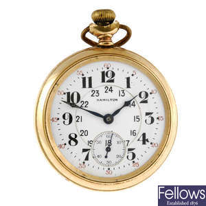 An open face pocket watch by Hamilton with travel case.