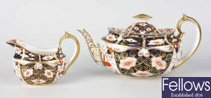 A Royal Crown Derby teapot, sucrier and milk jug, etc.