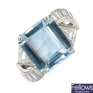 An aquamarine and diamond dress ring.