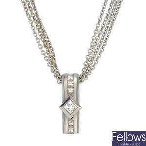 An 18ct gold diamond pendant with chain.