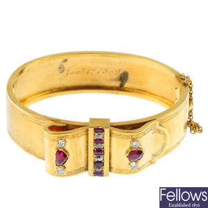 A mid 19th century 15ct gold ruby and diamond bangle.