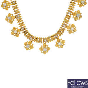 A late 19th century 18ct gold seed pearl necklace.