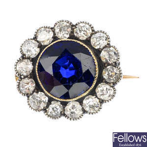 An early 20th century silver and 9ct gold sapphire and diamond cluster brooch.