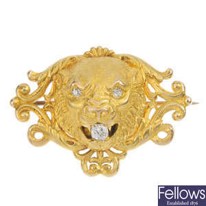 A mid 20th century diamond lion mask brooch.