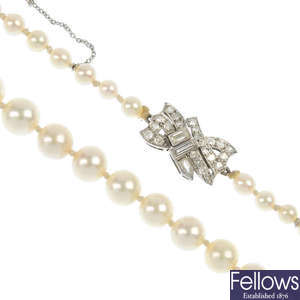 A cultured pearl necklace with an early 20th century diamond clasp.