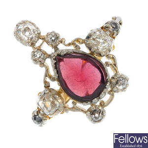 A late 19th century platinum and 18ct gold garnet and diamond ring.