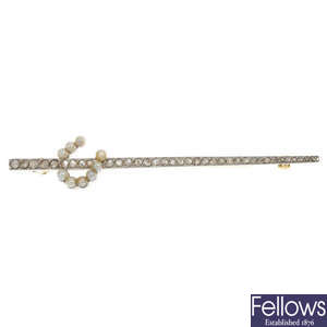 An early 20th century platinum and 15ct gold seed pearl and diamond brooch. 