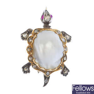 An early 20th century silver and gold blister pearl and diamond novelty brooch.