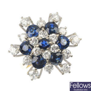 An 18ct gold diamond and sapphire floral cluster ring. 