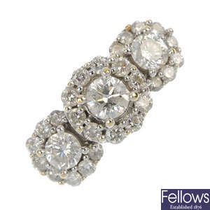 A 14ct gold diamond triple cluster ring.