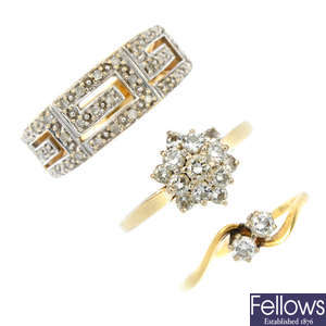 A selection of three gold diamond rings.