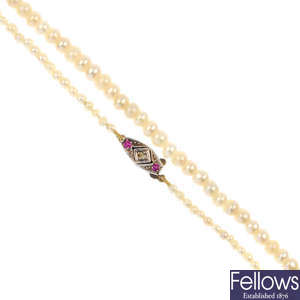 A natural pearl single-strand necklace, with gem-set clasp.