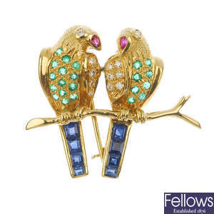 A novelty diamond and gem-set bird brooch.