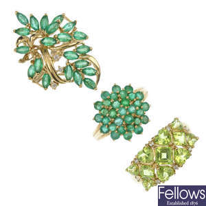 A selection of three 9ct gold emerald and peridot dress rings.