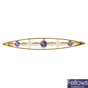 An early 20th century gold sapphire and seed pearl bar brooch. 