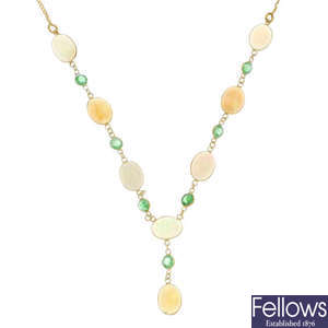 An opal and emerald necklace.