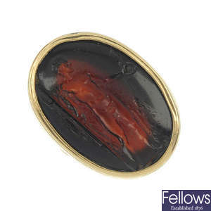 A late 19th century gold glass intaglio ring.