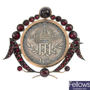 An early 20th century Austro-Hungarian coin paste and garnet brooch.