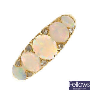An opal and diamond five-stone ring.