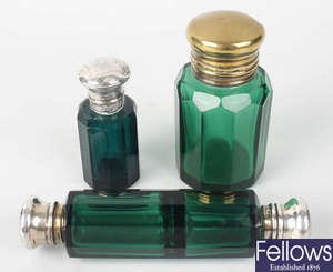 Four green glass scent phials
