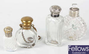 Five clear glass scent bottles