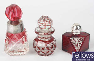 Three red glass scent bottles