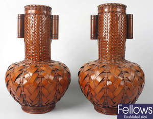 An unusual pair of Japanese woven cane and bamboo vases.