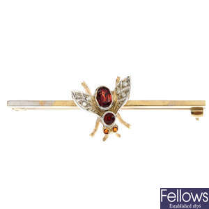 A 9ct gold garnet and diamond insect brooch.