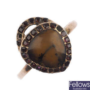 An early 19th century 9ct gold dendritic agate and garnet ring.