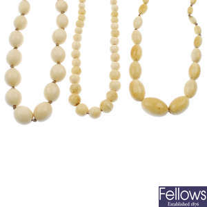 Two early 20th century ivory necklaces and an ivory and bone necklace.