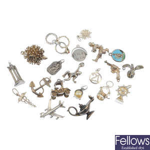 A selection of silver and white metal charms and charm bracelets.