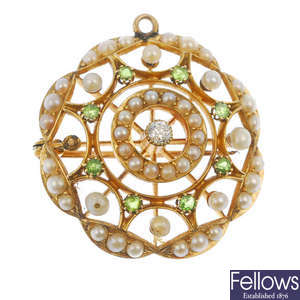 An early 20th century 15ct gold diamond, demantoid garnet and seed pearl brooch. 