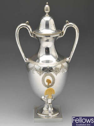 A silver plated tea urn.