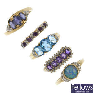 A selection of five 9ct gold gem-set rings.