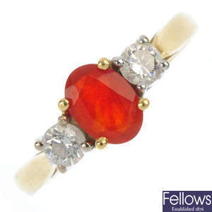An 18ct gold fire opal and diamond three-stone ring.