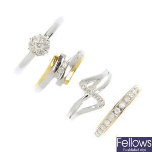 A selection of four 9ct gold diamond rings.