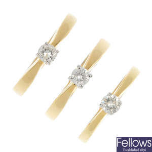 A selection of three 18ct gold diamond single-stone rings.