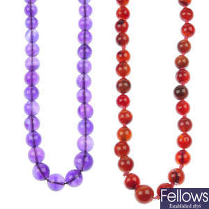 Two graduated single-strand bead necklaces.