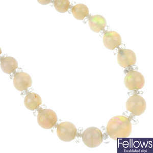 A mid 20th century opal and rock crystal bead single-strand necklace.