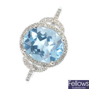 A topaz and diamond dress ring.