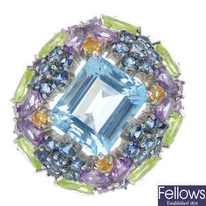 A multi-gem floral dress ring.