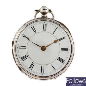 An open face pocket watch together with a silver chain and fob.