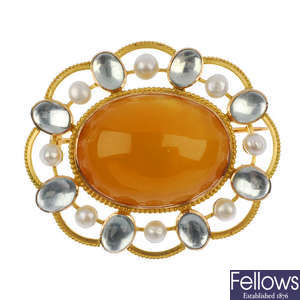 An amber, aquamarine and seed pearl brooch.