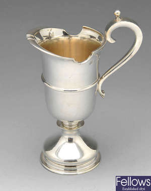 A modern silver cream jug.